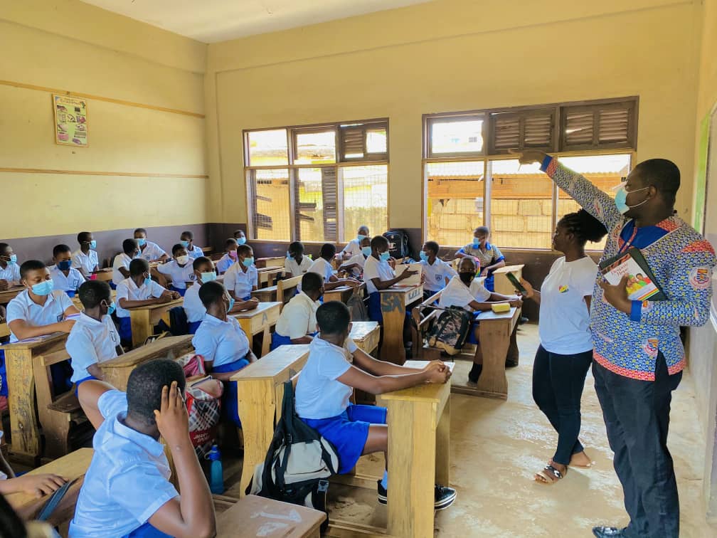 A health professional from Ghana Health service interacting with junior High School pupils.